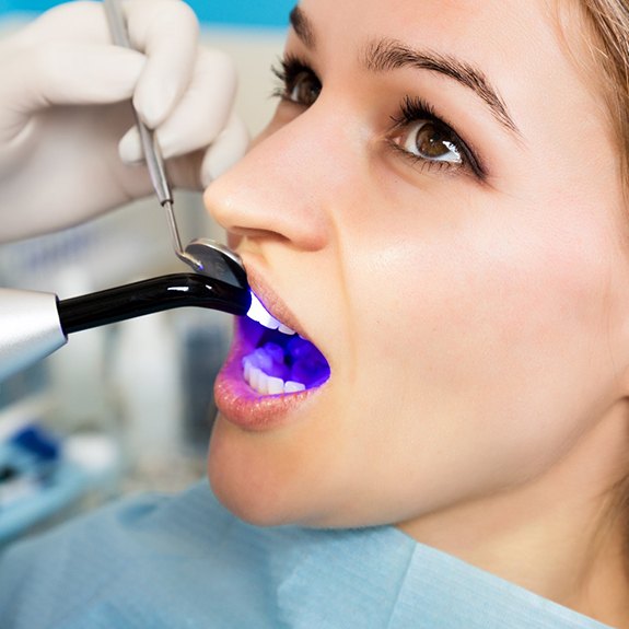 Woman receiving cosmetic dental bonding in Grand Prairie, TX